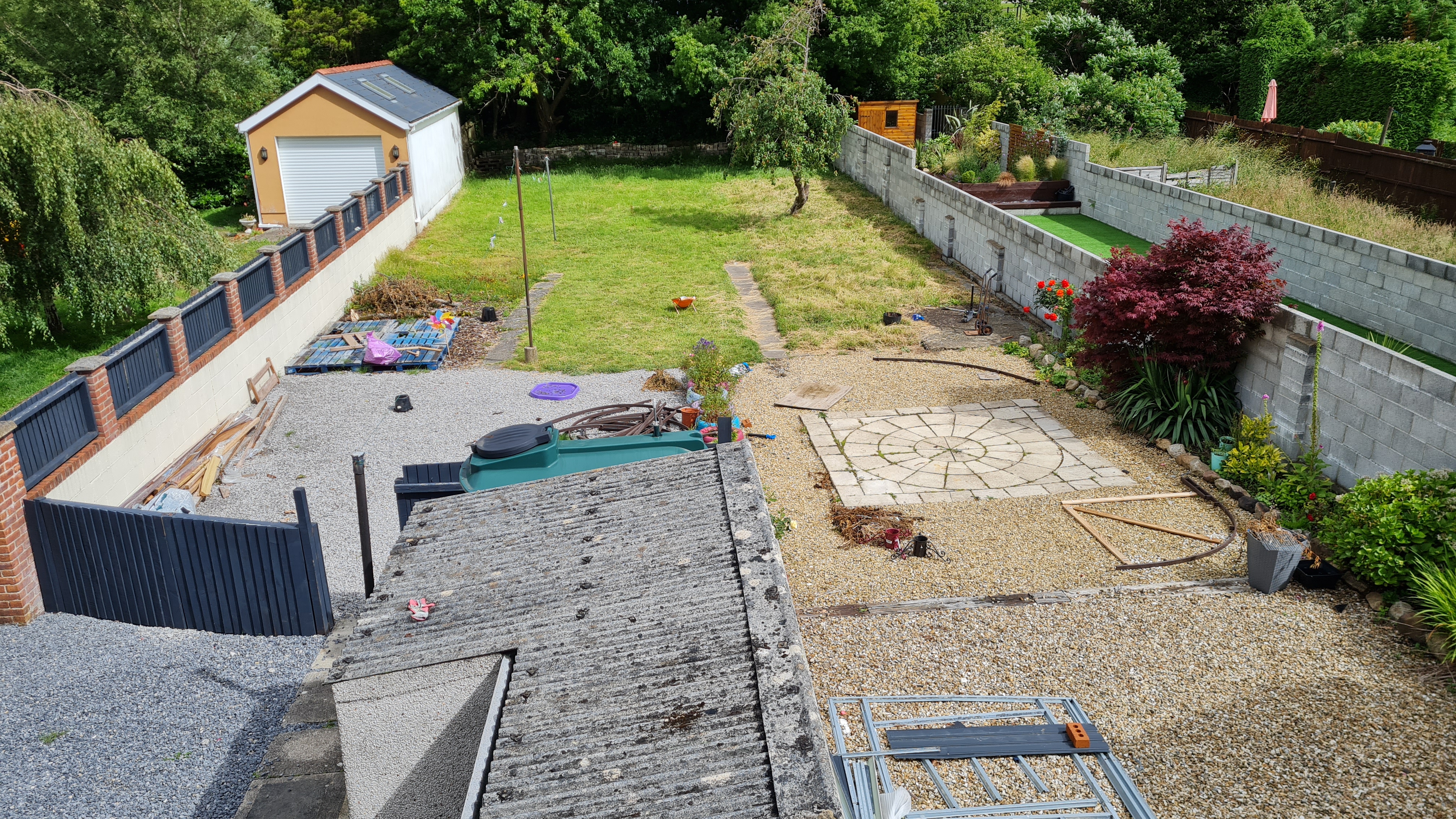 Overall view, base of L.extends to edge of outhouse, long side extends up to approx metal shed base.