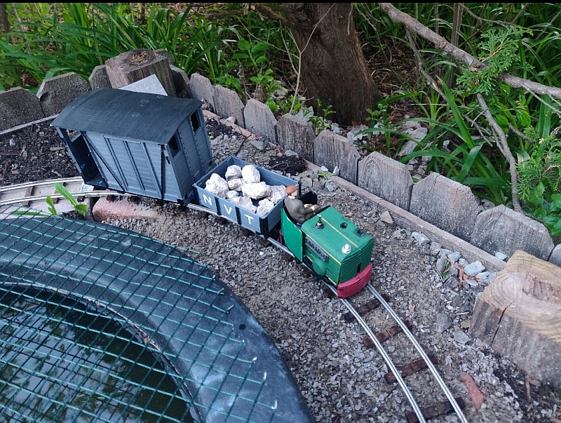 6 - Bringing ballast boulders for the bare bricks and a brake van around the back bend.jpg
